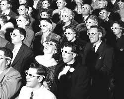 People wearing 3D glasses in an old movie theater.